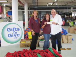 Bev and Sharon present a check to Jim