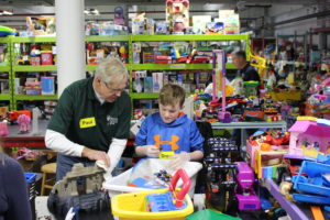 A Vice President and a fourth grader working in the Toy Department
